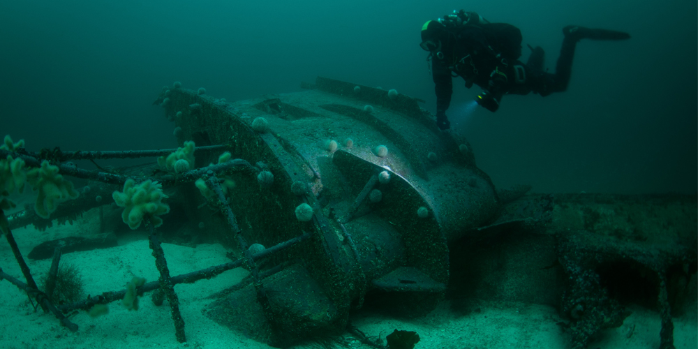 Diver approaching wreck in Shetland 