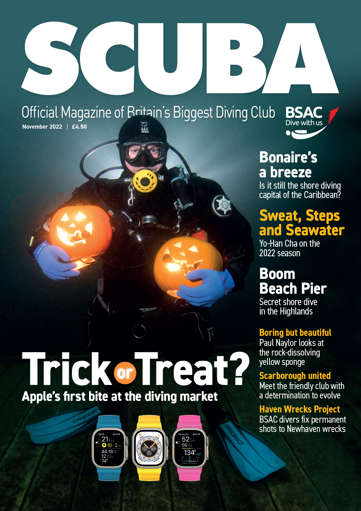 man diving holding pumpkins for halloween